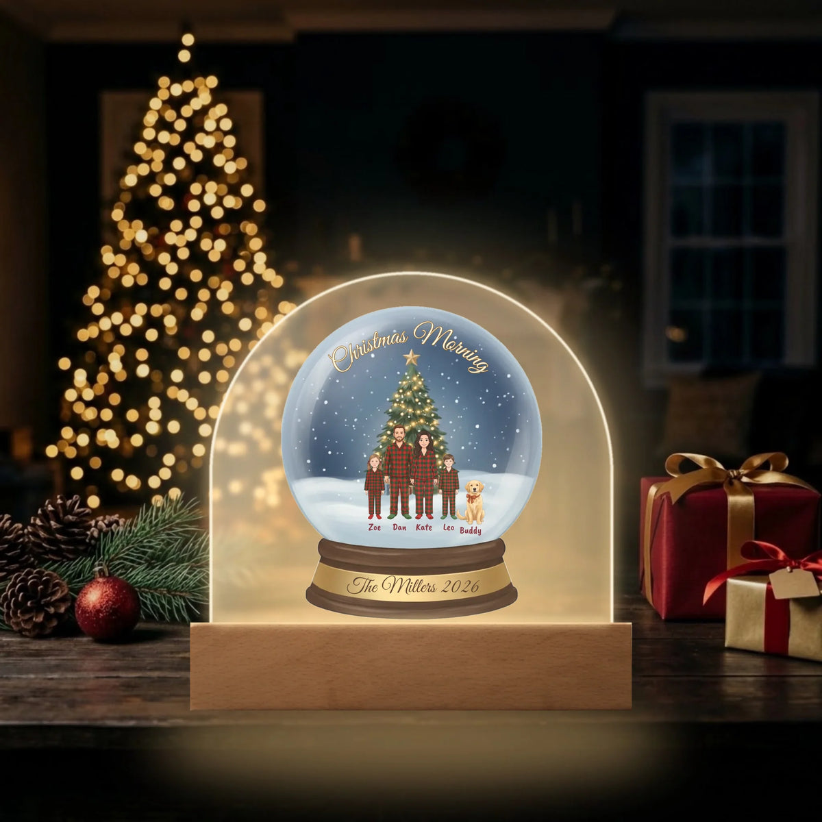 LED dome plaque lit up beside a glowing Christmas tree and presents at night