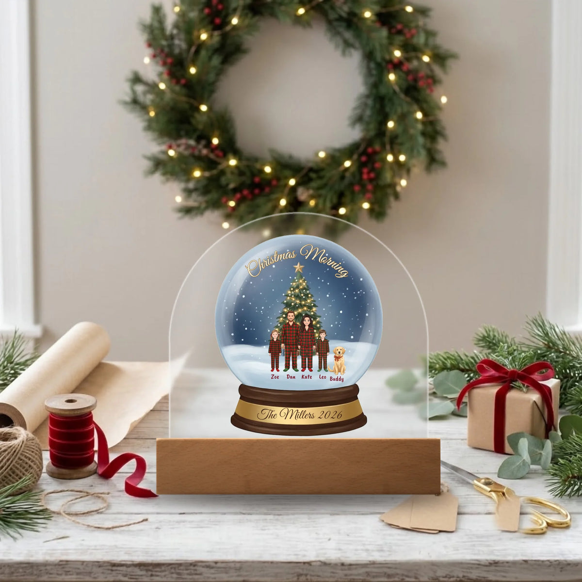 Personalized dome plaque Christmas gift on a gift-wrapping table with kraft paper and ribbon